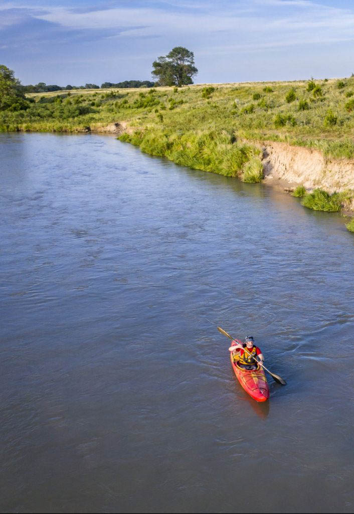 kayaker on Dismal RIver in Nebraska