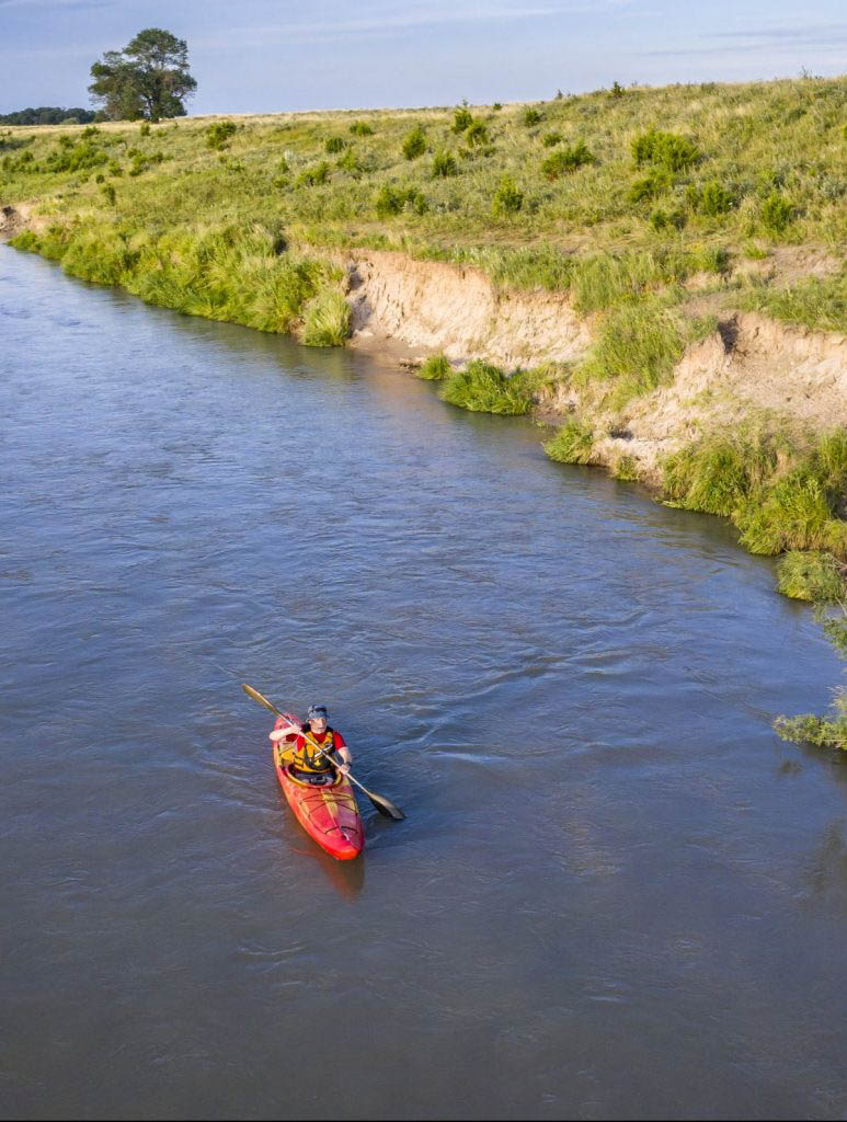 kayaker on Dismal RIver in Nebraska