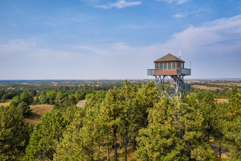 lookout tower in Nebraska National Forest, aerial view of early fall scenery, travel concept